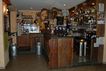 Bancone bar realizzato in legno di larice antico per "Bar Osteria Lo Peyo"